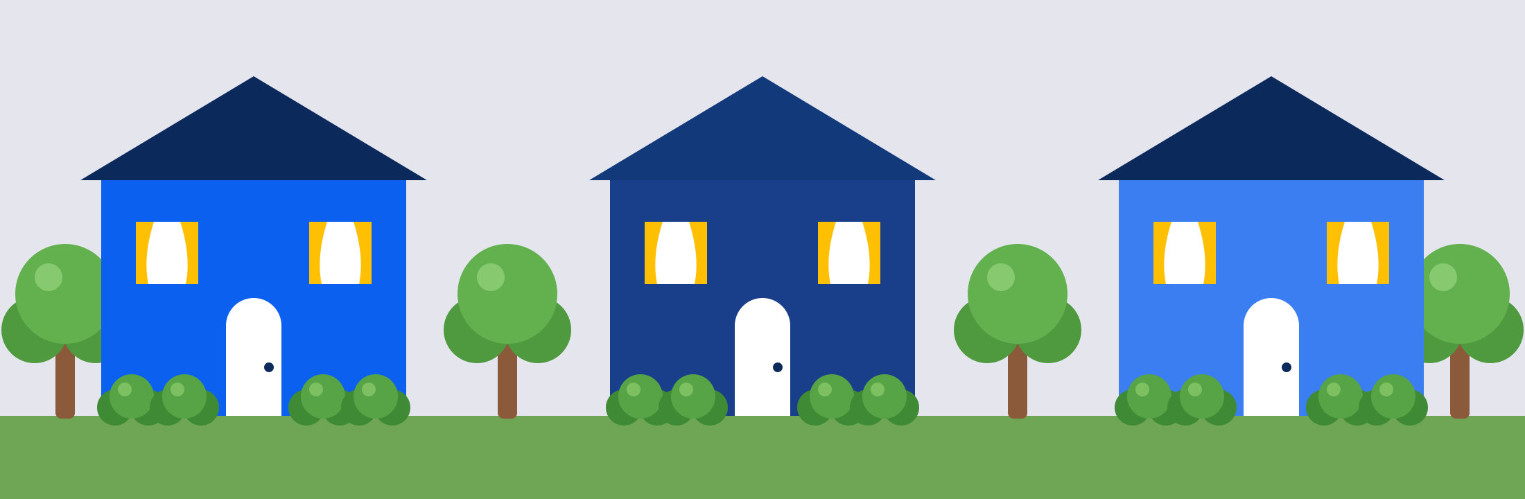 Three townhomes with trees and bushes